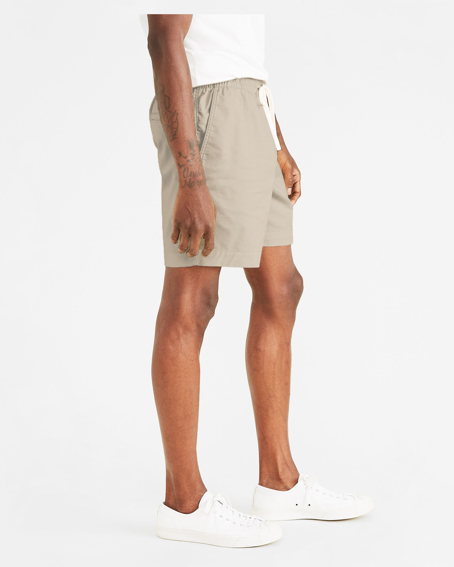 Side view of model wearing Sahara Khaki Playa 7" Shorts.