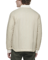 Back view of model wearing Sahara Khaki Recycled Nylon Channel Quilted Bomber Jacket.