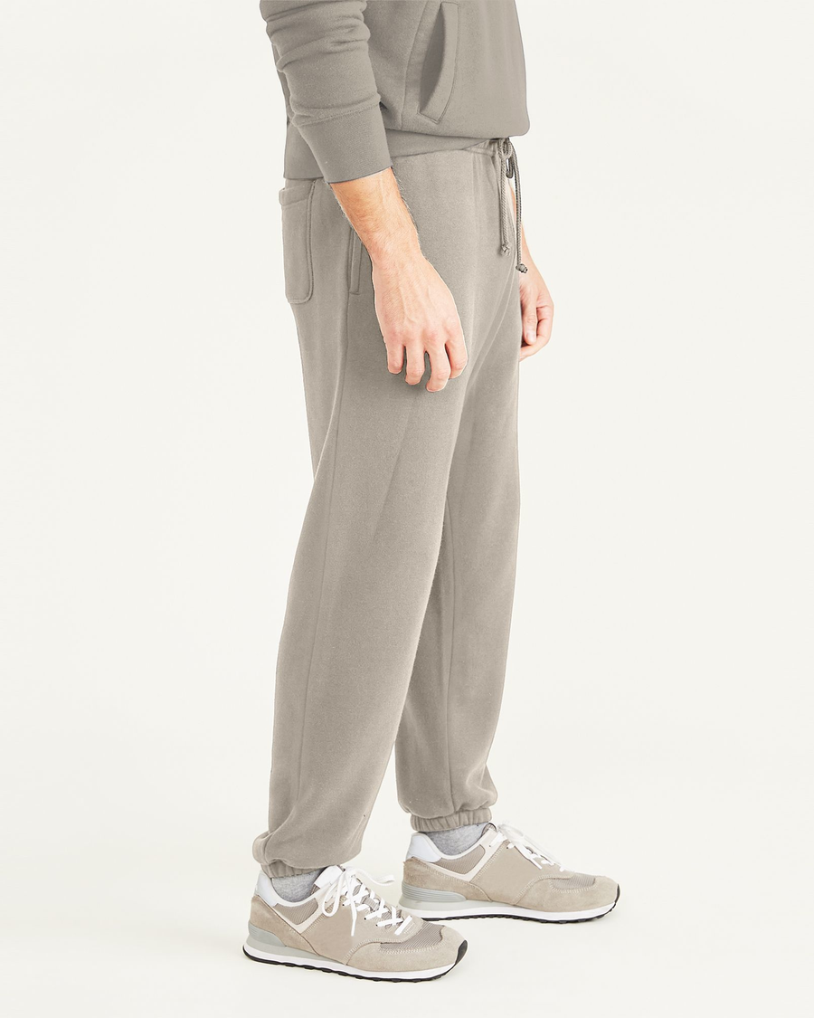 Side view of model wearing Sahara Khaki Sport Sweatpants, Straight Fit.