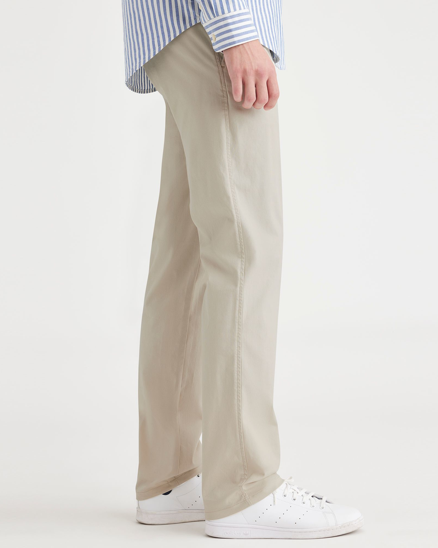 Side view of model wearing Sahara Khaki Ultimate Chinos, Slim Fit.