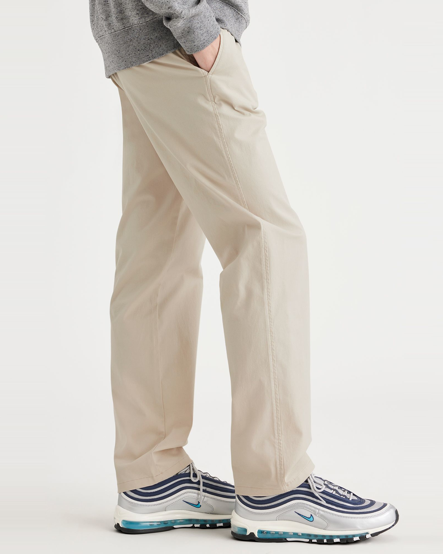 Side view of model wearing Sahara Khaki Ultimate Chinos, Straight Fit.