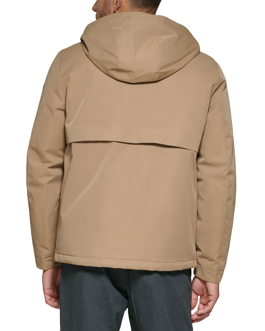 Back view of model wearing Sahara khaki Flex Tech Welded Flange Hoodie.