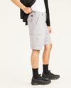 Side view of model wearing Sharkskin Cargo 9" Shorts, Classic Fit.