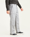 Side view of model wearing Sharkskin Cargo Pants, Relaxed Fit.