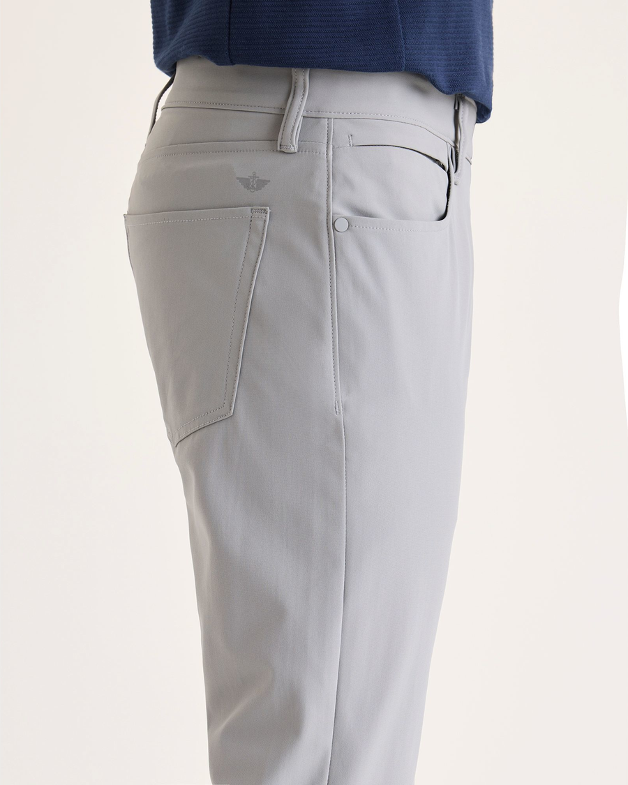 Side view of model wearing Sharkskin Go Airweave 5-Pocket, Slim Tapered Fit.