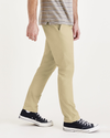 Side view of model wearing Silver Sage Ultimate Chinos, Skinny Fit.