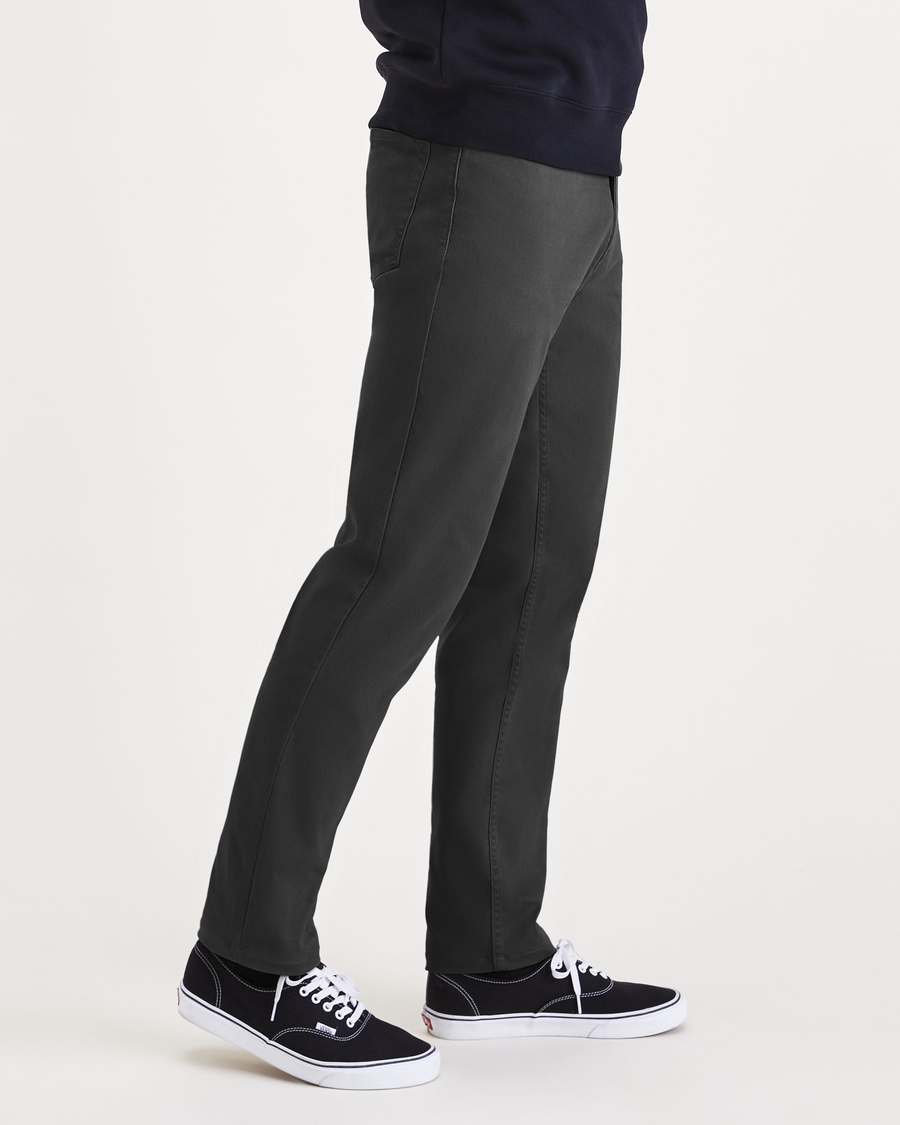 Side view of model wearing Steelhead Jean Cut Pants, Athletic Fit.