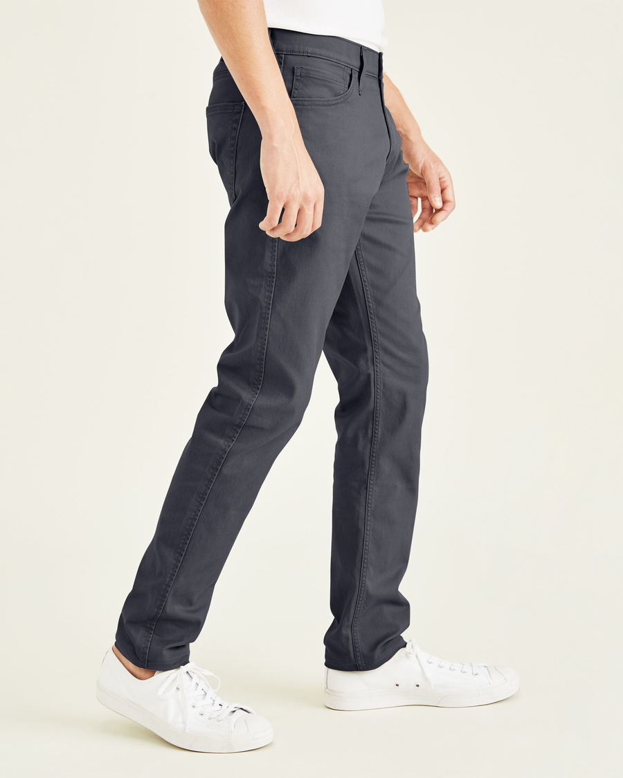 Side view of model wearing Steelhead Jean Cut Pants, Slim Fit.