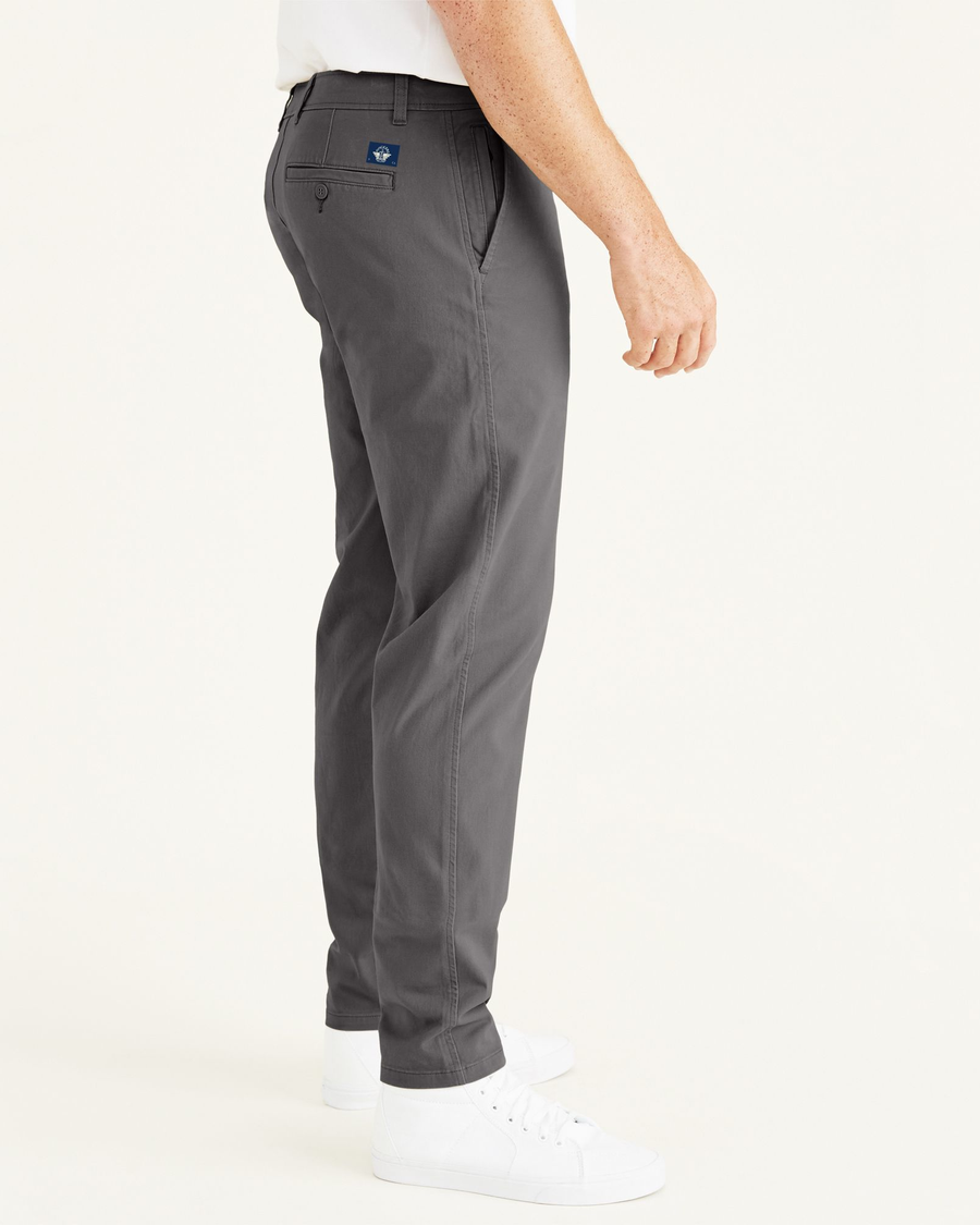 Side view of model wearing Steelhead Ultimate Chinos, Athletic Fit (Big and Tall).