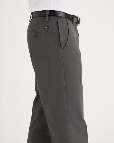 Side view of model wearing Storm Workday Khakis, Straight Fit.