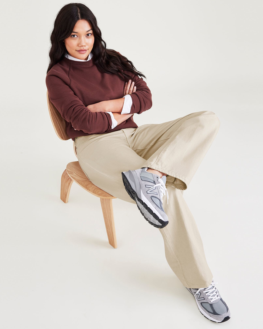 View of model wearing Tan Mid-Rise Jeans, Relaxed Fit.