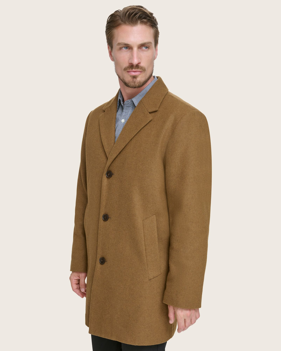 Side view of model wearing Tan Wool Blend Top Coat.