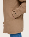 View of model wearing Tan Wool Blend Walking Coat w/ Bib.