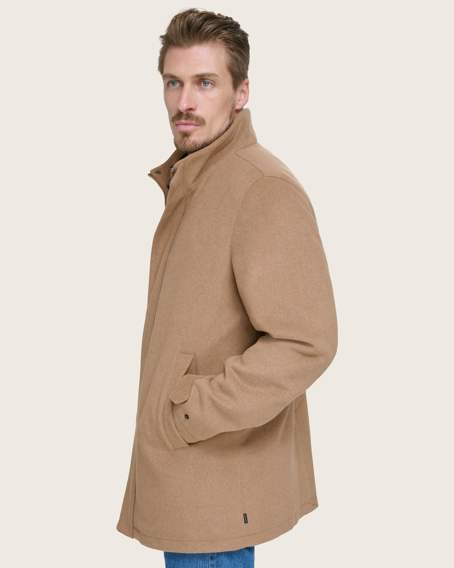 Side view of model wearing Tan Wool Blend Walking Coat w/ Bib.