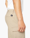 View of model wearing Taupe Sand Smart 360 Tech Cargo 9" Shorts (Big and Tall).