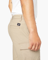 View of model wearing Taupe Sand Tech Cargo 9" Shorts.
