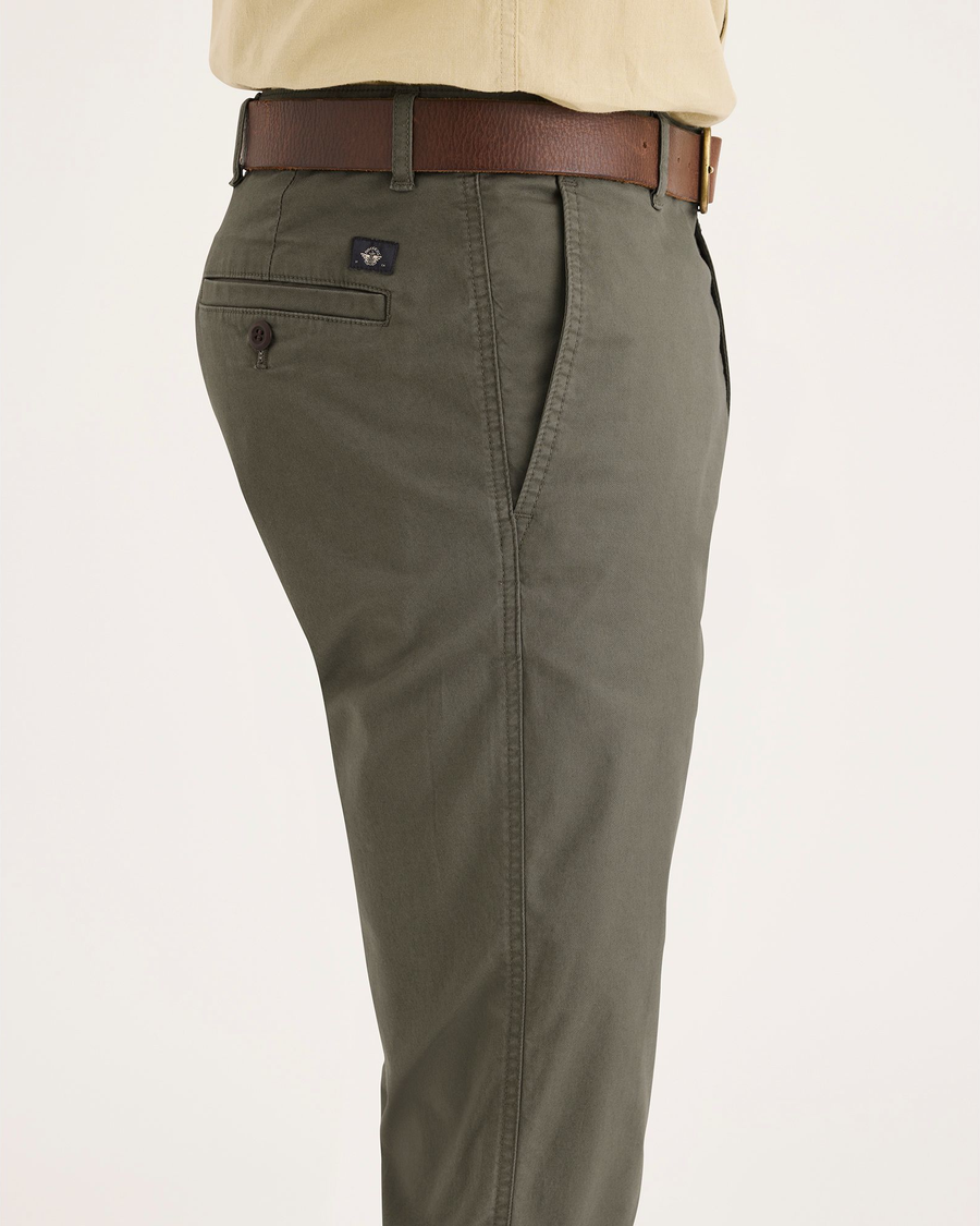 Side view of model wearing Tea Leaf Original Chinos, Slim Fit.