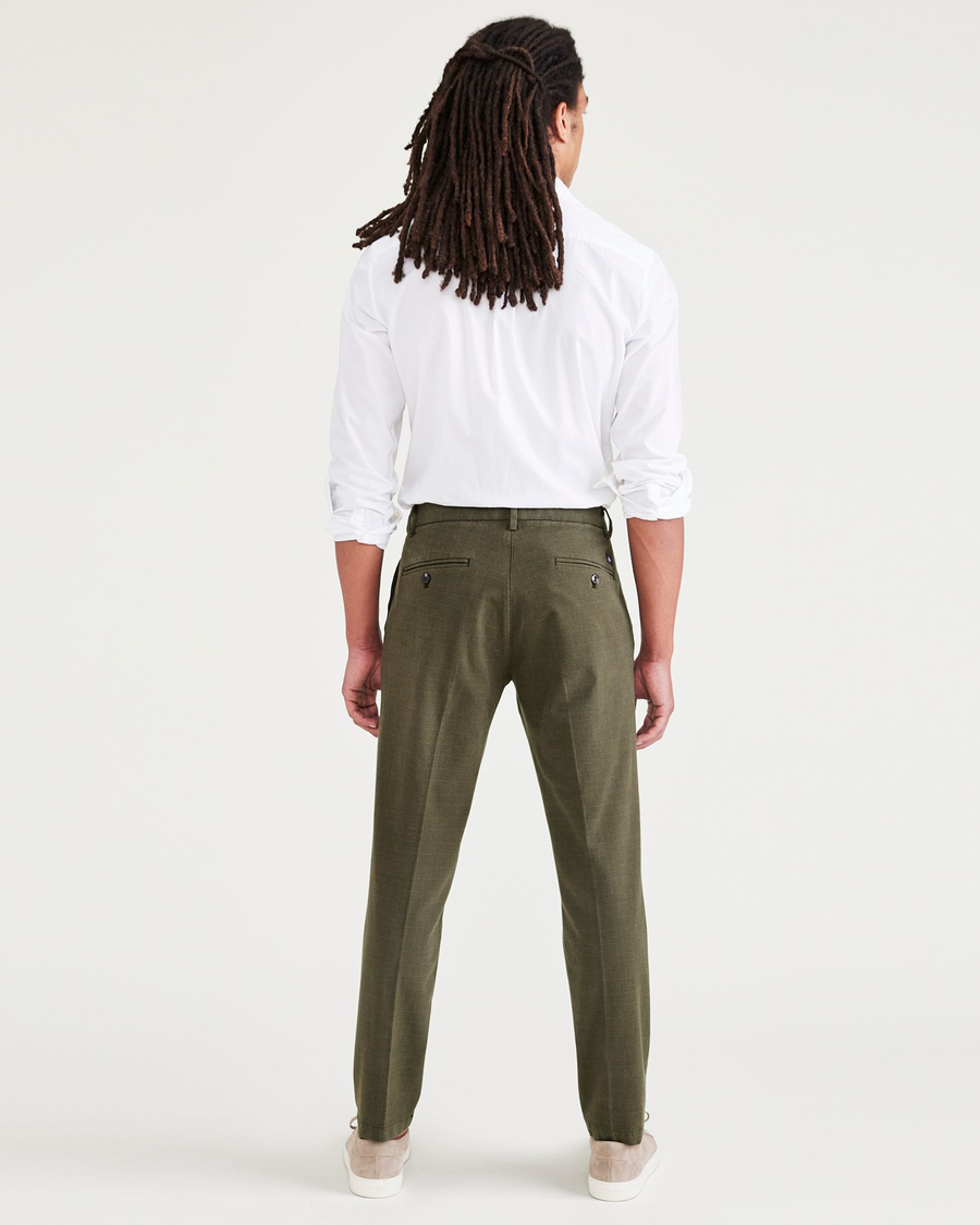 Back view of model wearing Tempo Forest Night Crafted Trousers, Slim Tapered Fit.