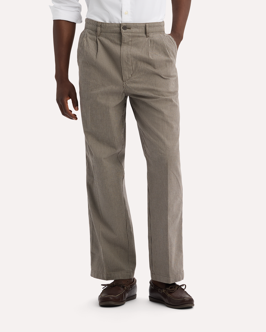 View of model wearing Thunderstorm Grey Eighty-Six Original Pleated Chinos, Loose Fit.