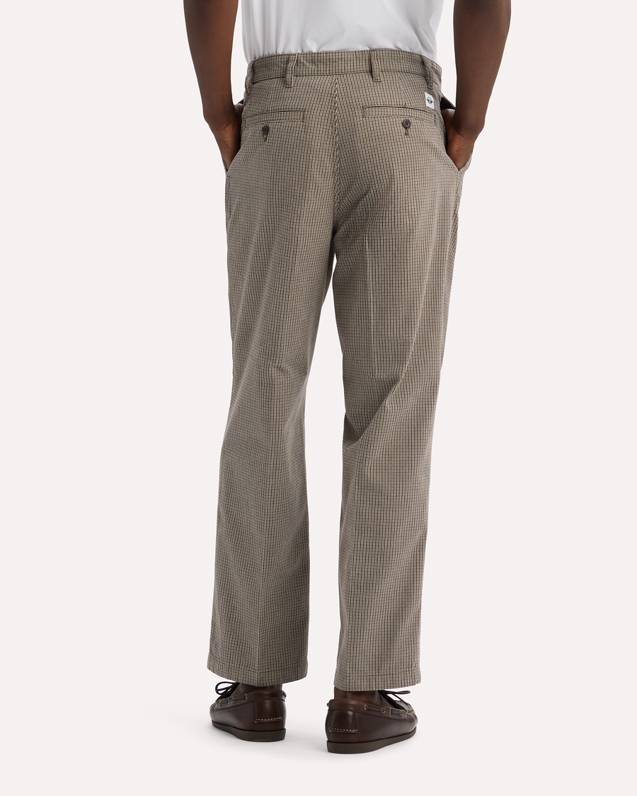 View of model wearing Thunderstorm Grey Eighty-Six Original Pleated Chinos, Loose Fit.