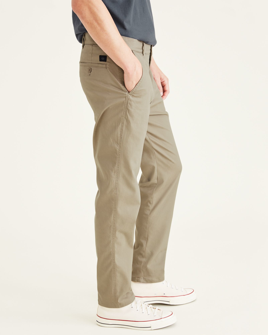 Side view of model wearing Timber Wolf Original Chinos, Straight Tapered Fit.