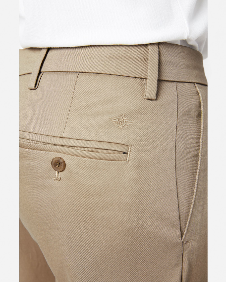View of model wearing Timber Wolf Signature Khakis, Pleated, Classic Fit.