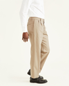 Side view of model wearing Timber Wolf Signature Khakis, Pleated, Classic Fit.