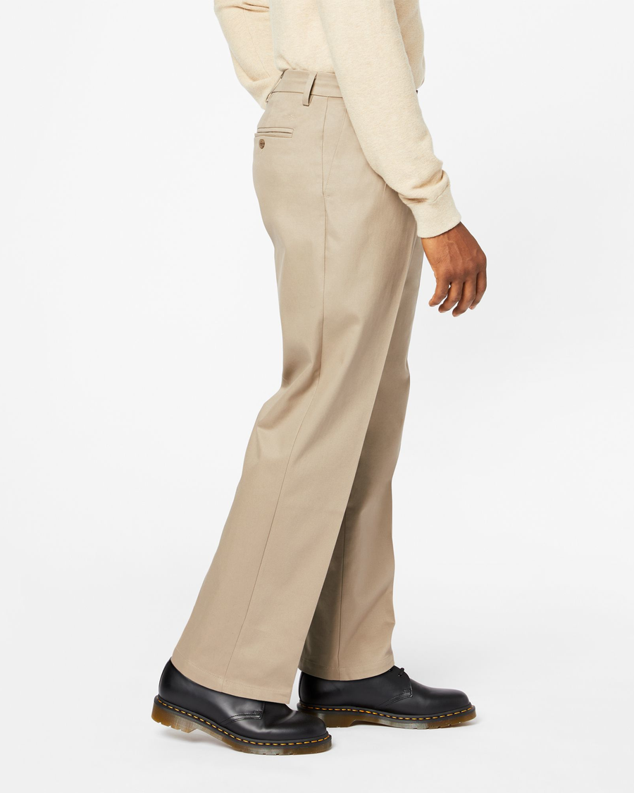 Side view of model wearing Timber Wolf Signature Khakis, Pleated, Relaxed Fit.