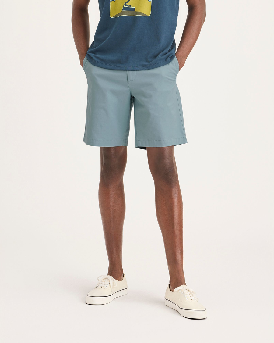 Front view of model wearing Tourmaline Ultimate 9.5" Shorts.