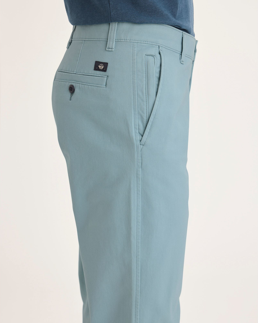 Side view of model wearing Tourmaline Ultimate Chinos, Straight Fit.