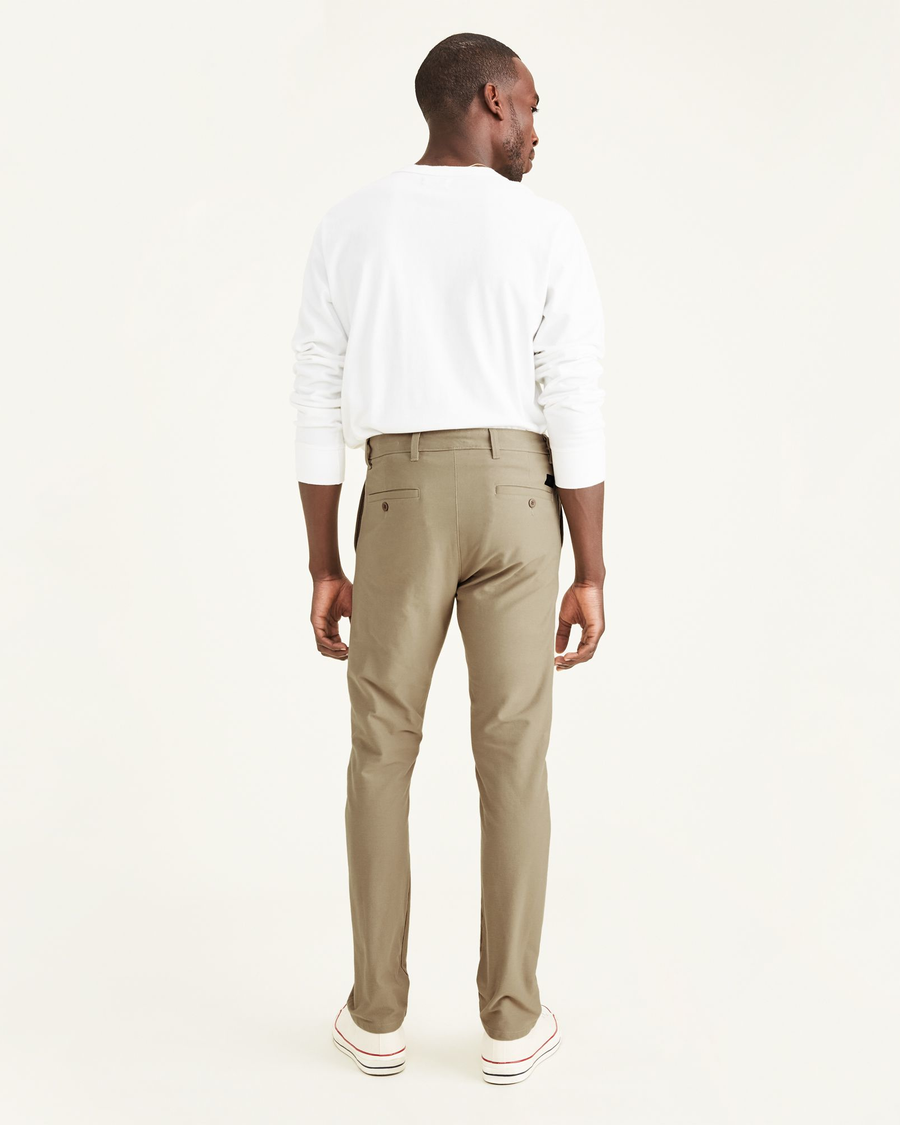 Back view of model wearing True Chino Comfort Knit Chinos, Slim Fit.