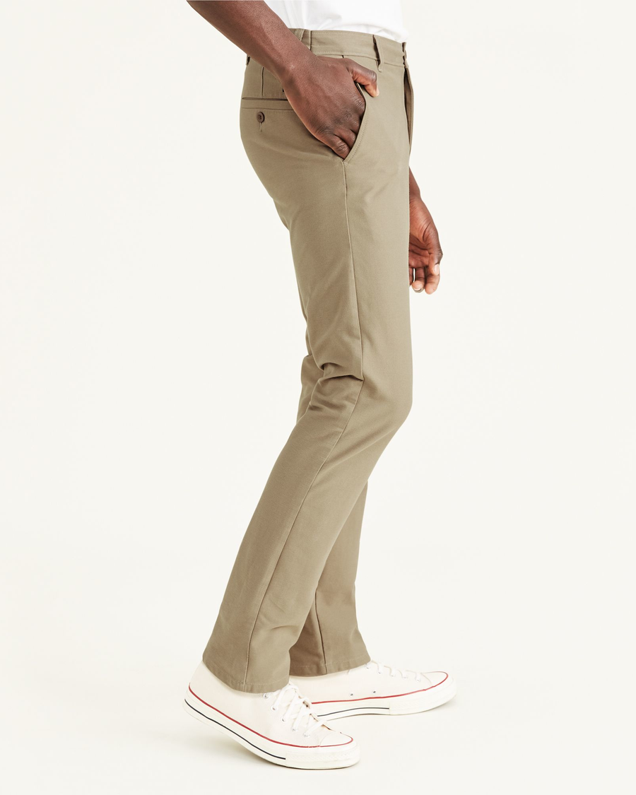 Side view of model wearing True Chino Comfort Knit Chinos, Slim Fit.