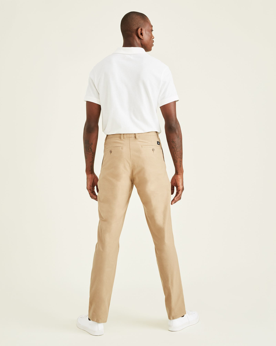 Back view of model wearing True Chino Comfort Knit Chinos, Straight Fit.