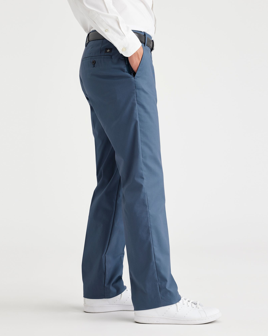 Side view of model wearing Vintage Indigo City Tech Trousers, Straight Fit.