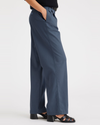 Side view of model wearing Vintage Indigo High Wide Pant, Pleated.