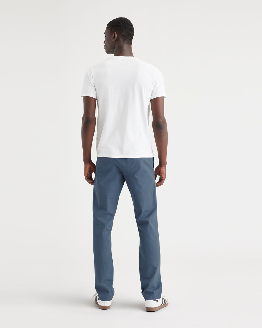 Back view of model wearing Vintage Indigo Ultimate Chinos, Athletic Fit.