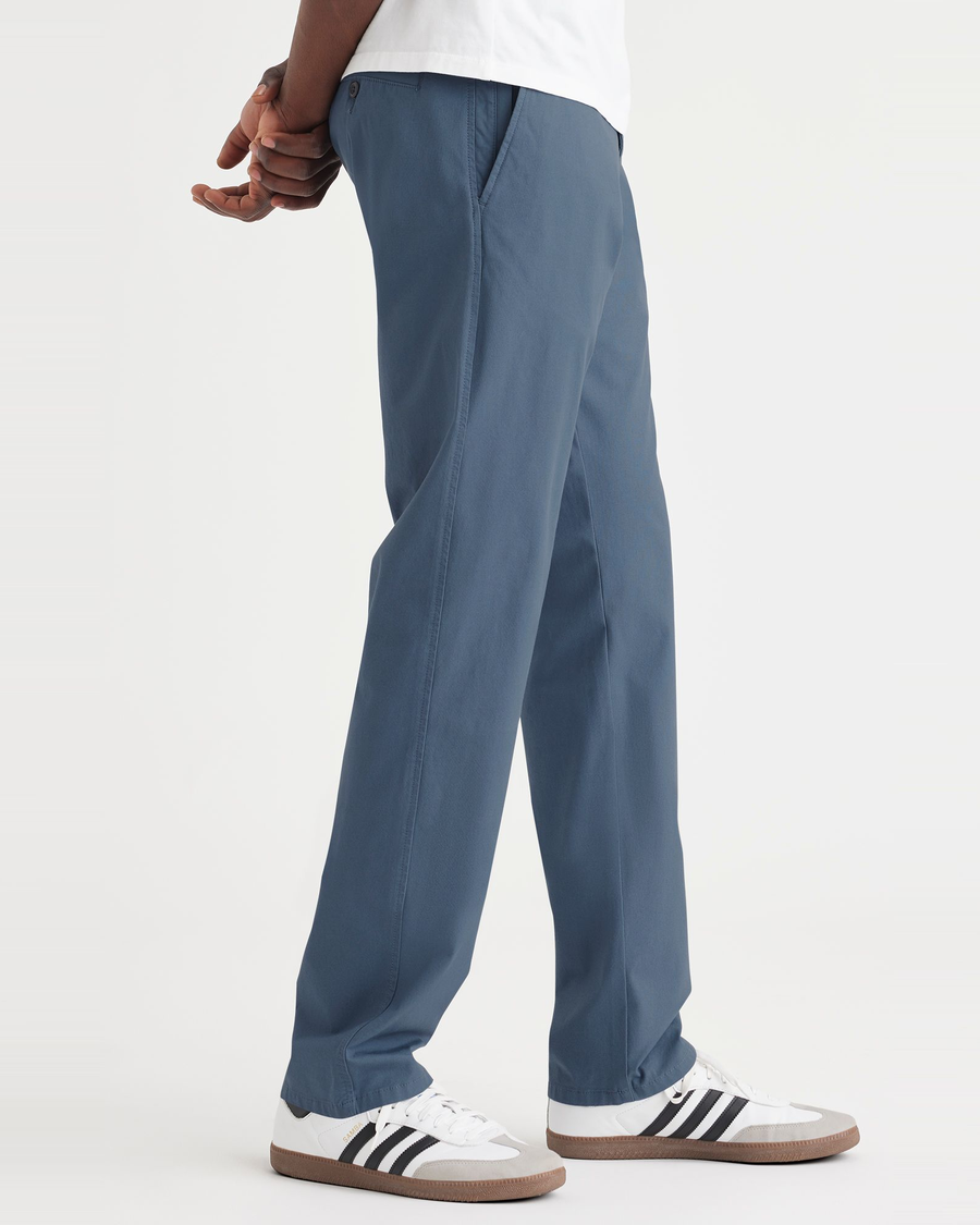 Side view of model wearing Vintage Indigo Ultimate Chinos, Athletic Fit.
