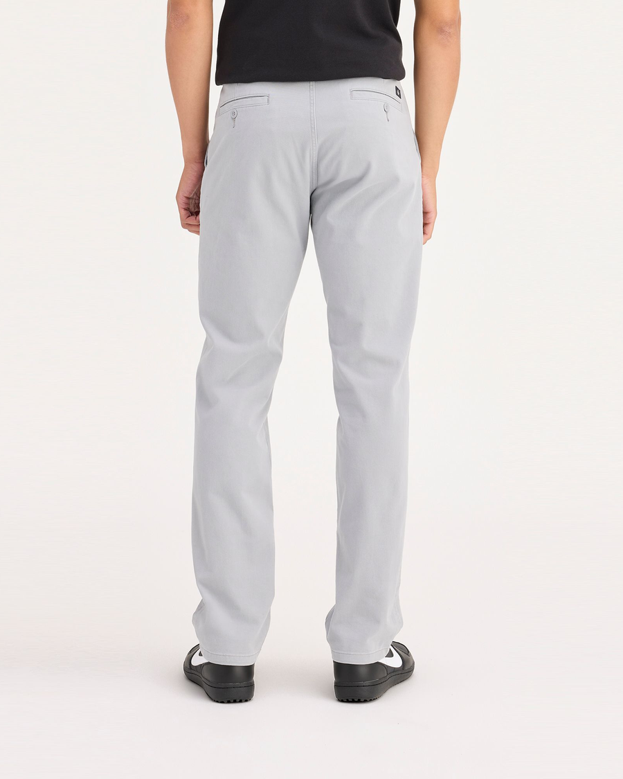 Back view of model wearing Wet Stone Ultimate Chinos, Slim Fit.