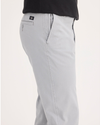 Side view of model wearing Wet Stone Ultimate Chinos, Slim Fit.