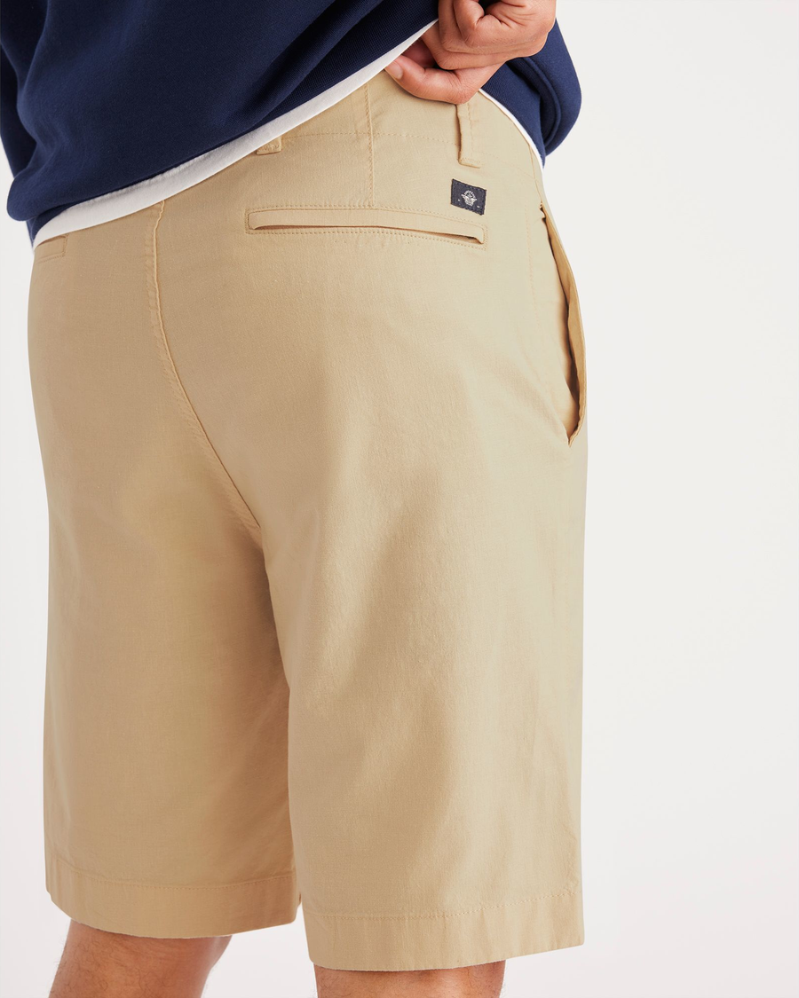 View of model wearing Wheat Alpha 8" Shorts.