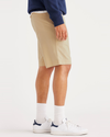 Side view of model wearing Wheat Alpha 8" Shorts.