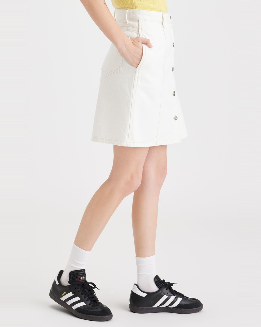 Side view of model wearing White Button Front Mini Skirt.