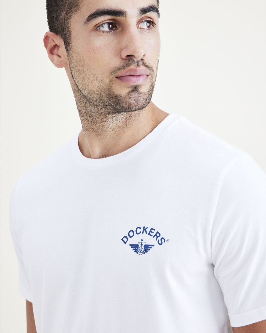 View of model wearing White + Wing & Anchor Logo Tee, Slim Fit.